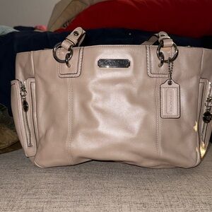 NWOT Coach Bag Comes with a dust bag never used it. Iridescent Color